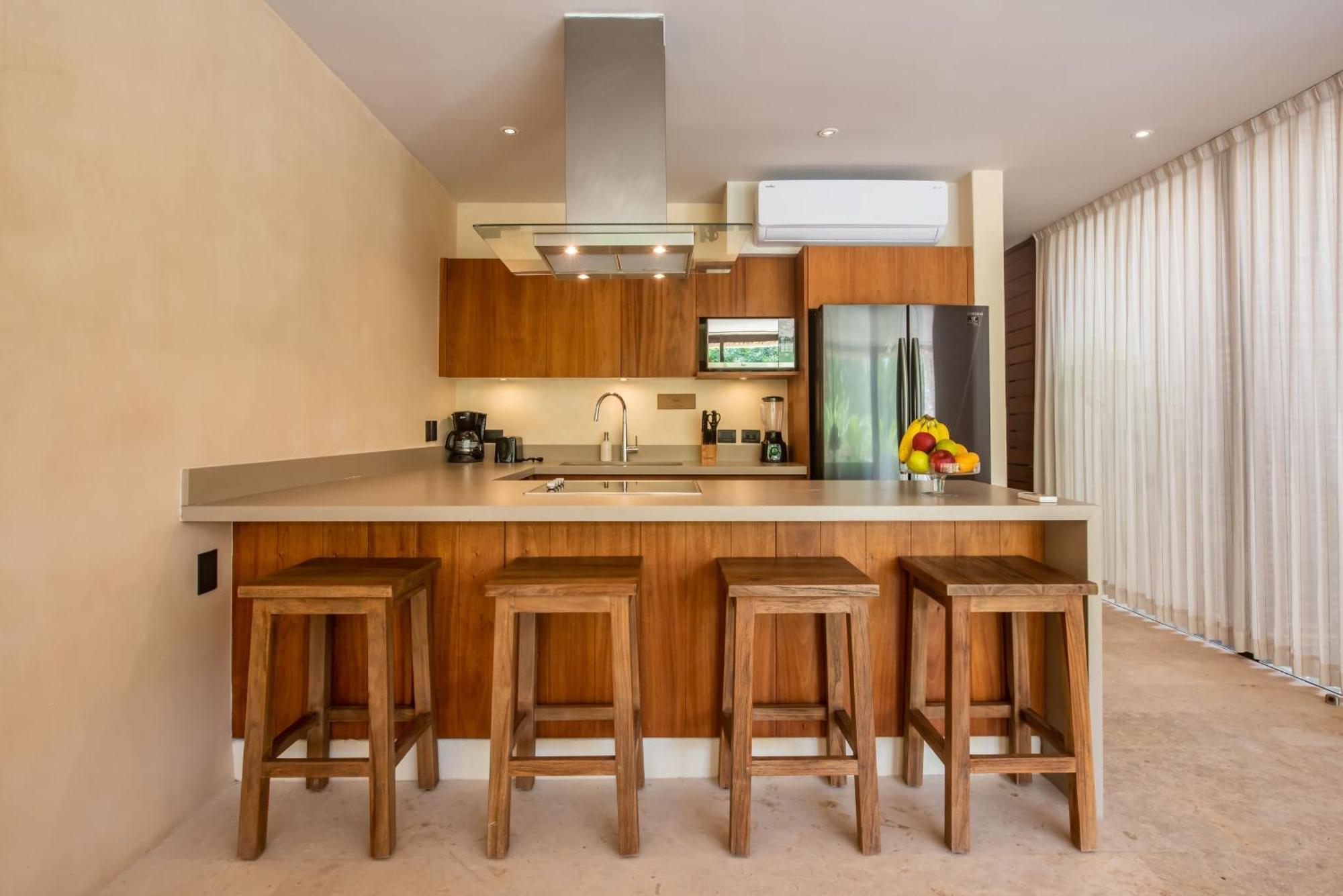 Copal Tulum Hotel Extérieur photo A kitchen with a breakfast bar